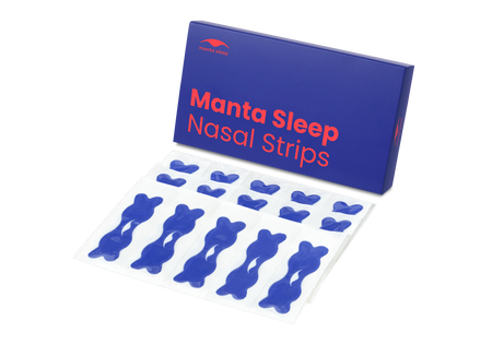 A blue Manta Sleep Nasal Strips product box standing next to several blue nasal strips in clear backing sheets, isolated on white.